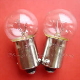 Two miniature 12v 5w ba9s g14 replacement light bulbs on red background